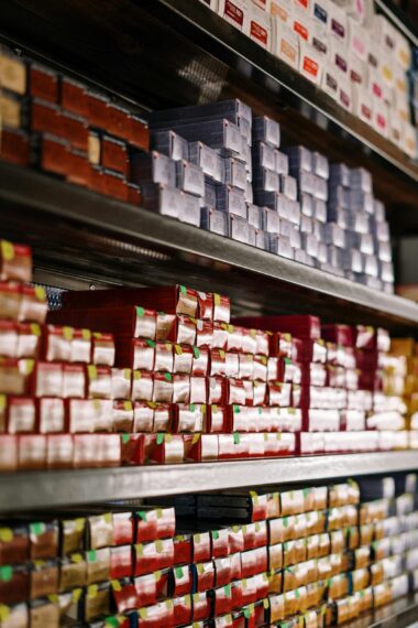 Red and White Plastic Containers on Shelf